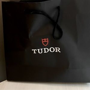 Original Tudor black leather watch strap. My husband prefers the stainless